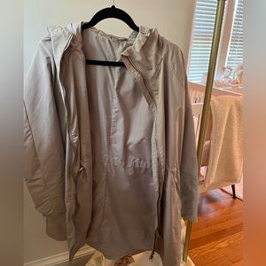 Athleta raincoat. Beige. Size medium. Never worn
